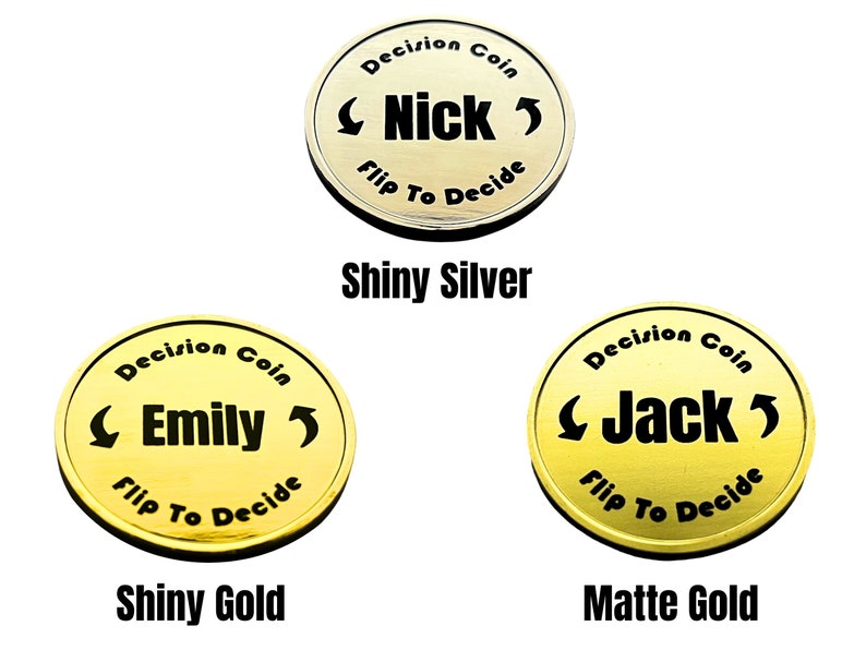 May include: Three gold-colored decision coins with the words "Decision Coin" and "Flip To Decide" around the edge. The coins feature the names "Nick", "Emily", and "Jack" in black lettering. The coins are labeled "Shiny Silver", "Shiny Gold", and "Matte Gold".
