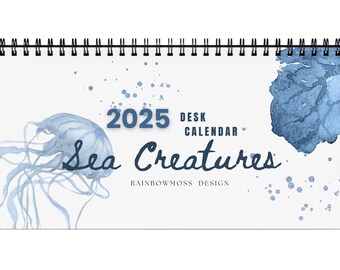 May include: A 2025 desk calendar featuring a watercolour illustration of a jellyfish and the text "Sea Creatures" with the words "Desk Calendar" and "Rainbowmoss Design" below.