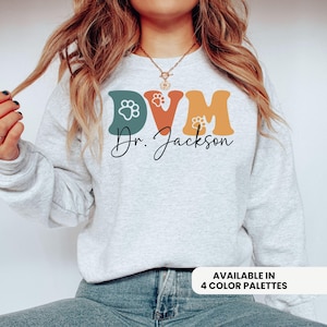 DVM Sweatshirt, Personalized Name Doctor of Veterinary Medicine Crewneck, Cute Veterinary Doctor Sweater with Paw Prints, Custom DVM Gifts