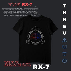 May include: A black t-shirt with a white outline of a Mazda RX-7 car and the text "RX-7" in Japanese characters. The text "Mazda RX-7" is printed in red and white on the bottom of the shirt. The text "ThrevAUTO" is printed vertically in blue on the right side of the shirt.