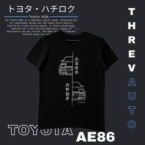 May include: Black t-shirt with a white outline of a Toyota AE86 car, the text "Toyota AE86" and the Japanese text "トヨタ・ハチロク" on the front. The text "ThrevAUTO" is on the right side of the image.