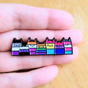 May include: A trio of ceramic mugs with a speckled, matte finish in cream, light grey, and dark grey. The mugs have a simple, minimalist design, suitable for coffee or tea.