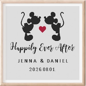 May include: A framed print featuring black silhouettes of two cartoon mice facing each other, with a red heart between them. The text "Happily Ever After" is above the names "Jenna & Daniel" and the date "2026.08.01."