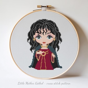May include: Cross-stitch pattern of a cartoon character in a wooden embroidery hoop. The character has black hair, blue eyes, and wears a red dress and a dark green cape. The text "Little Mother Gothel - cross stitch pattern" is at the bottom.