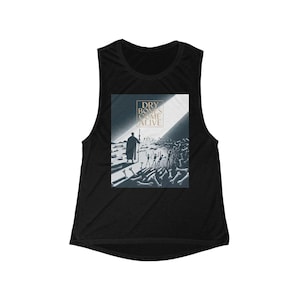 May include: Black muscle tank top featuring a graphic print. The print depicts a figure in a long coat holding a staff, with a beam of light shining on a crowd of skeletal figures. The text "DRY BONES COME ALIVE" is at the top.