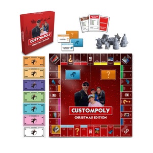 May include: A red and white board game called "Customopoly: Christmas Edition". The board features a family photo and a red background with white snowflakes. The game includes money, chance cards, and a game piece.