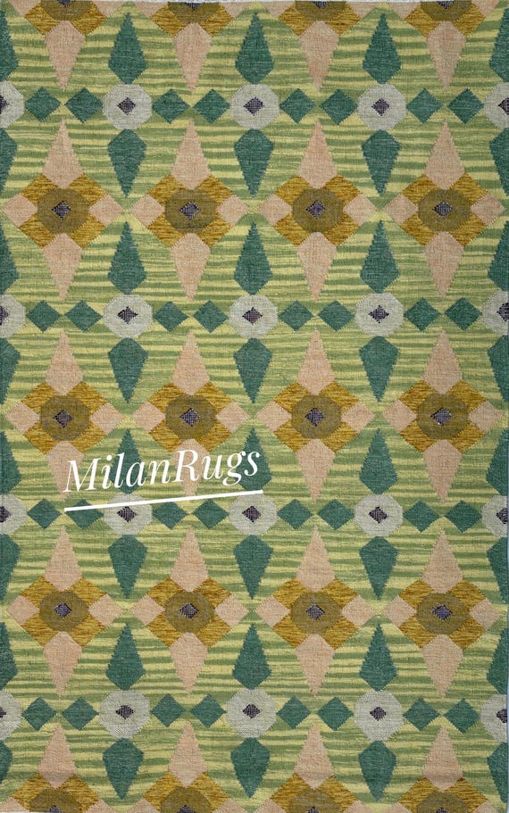 Scandinavian-style handwoven wool flatweave rug with a green, yellow, and beige geometric pattern
