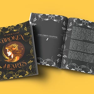 May include: A black book with a gold and white floral design on the cover. The title of the book is "BROKEN HEARTS" and the first chapter is titled "The First Chapter".