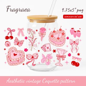 May include: A clear glass can-shaped tumbler with a bamboo lid and a straw. The tumbler is decorated with pink and red vintage-style illustrations of cherries, bows, cake, and other elements. Text on the image reads "Fragraea" and "Aesthetic vintage Coquette pattern."