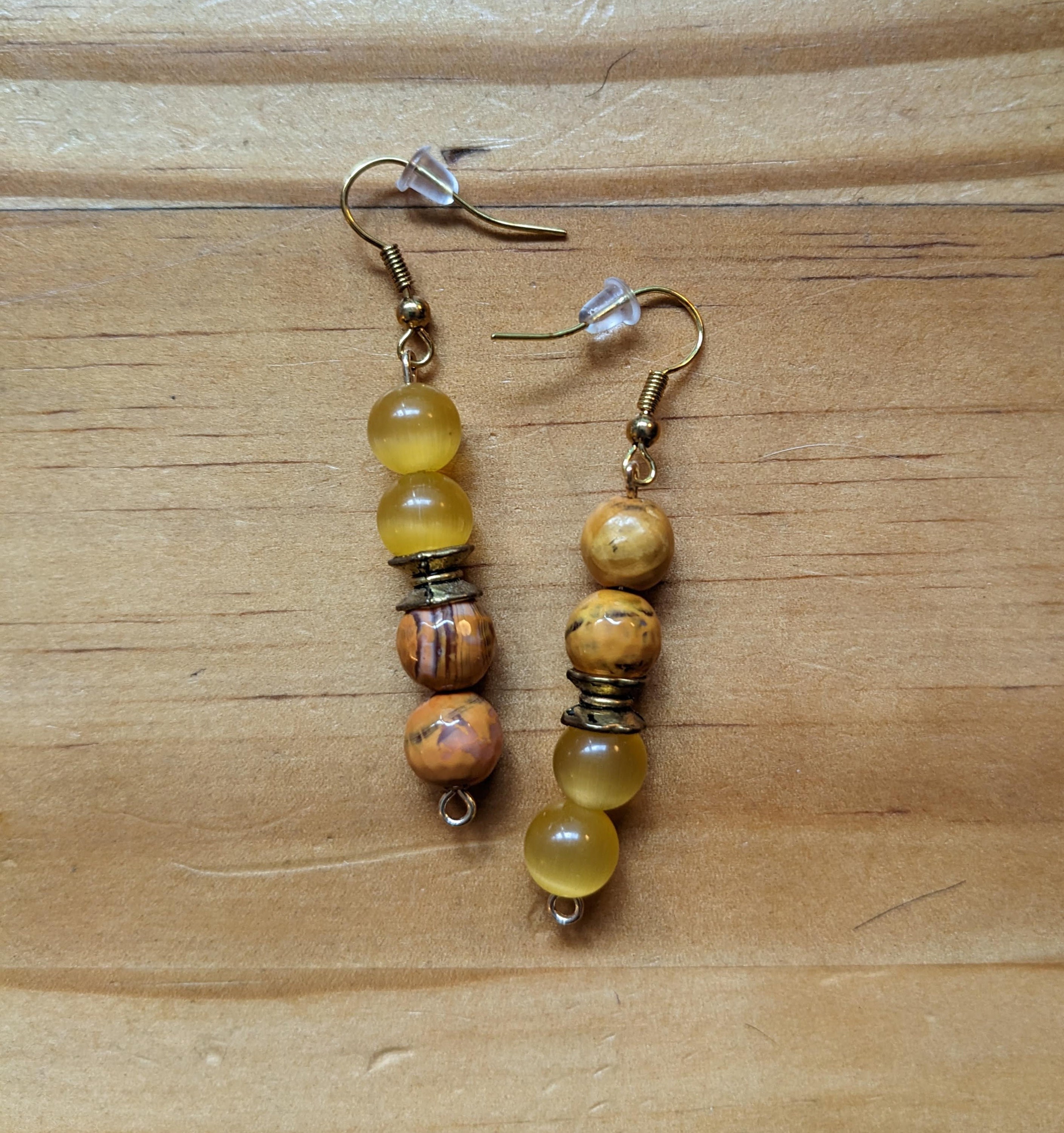Asymmetrical faceted brown jasper and yellow quartz earrings