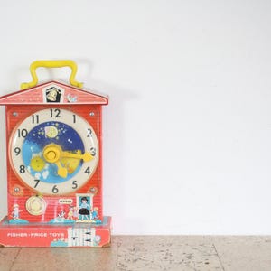 Vintage Fisher Price music box teaching clock from the sixties