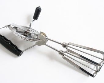 Vintage manual hand mixer or egg beater from the fifties