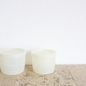 Two vintage small Tupperware storage containers from the seventies