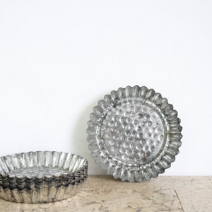 Six small vintage weathered tinplate cake moulds / baking tart tins / patisserie molds from the seventies