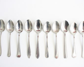 Ten mismatched dessert spoons from the seventies