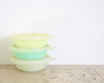 Three small vintage Tupperware storage containers from the seventies
