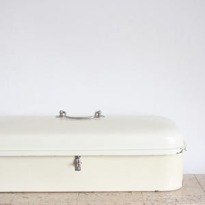 Vintage off white with a green rim enamel bread box or bread bin from the fifties