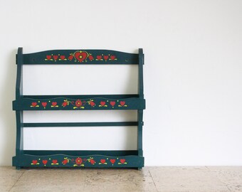 Vintage green wooden spice rack with painted hearts and flowers