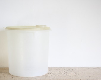 Two vintage extra large Tupperware storage containers with lids from the seventies