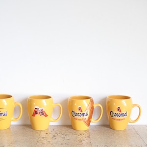Set of four yellow Chocomel cups, de enige echte by Nutricia