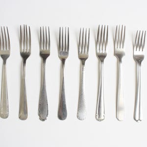 Ten mismatched dinner forks from the seventies - set 8