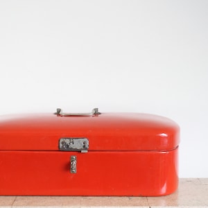Vintage red enamel bread box or bread bin from the fifties