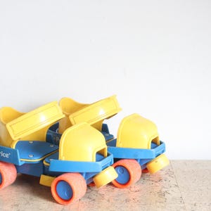 Vintage adjustable Fisher Price 1 2 3 roller skates from the eighties