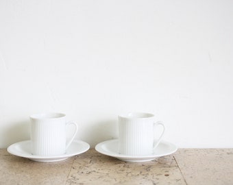 Two white porcelain Arzberg Cannelee or Series 2075 Secunda small cappuccino coffee cups and saucers