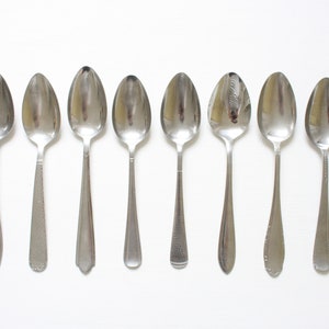 Ten mismatched dinner spoons from the seventies