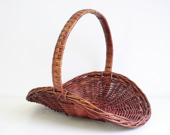 Brown vintage wicker basket for magazines, logs or flowers from the seventies