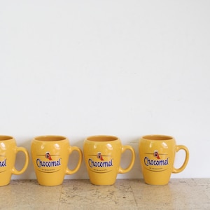 Set of four yellow Chocomel cups, de enige echte by Nutricia