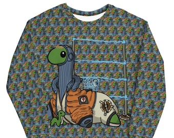 May include: Crew neck sweatshirt featuring a cartoon dinosaur character in a futuristic outfit. The dinosaur is primarily blue, orange, and white, with a green head and accents. The background is a repeating pattern of fish and plants.