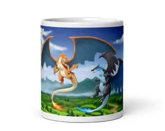 May include: White ceramic mug featuring a vibrant illustration of two dragons in a dynamic pose against a scenic backdrop. One dragon is orange with blue wings, the other is black with blue accents. The mug has a glossy finish.