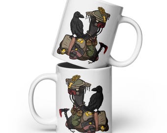 May include: Two white ceramic mugs with a black and brown illustration of a character wearing a helmet and a crow perched on top. The character is wearing a backpack and holding a weapon.