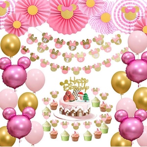 May include: Pink and gold Minnie Mouse themed birthday party decorations. The decorations include balloons, a banner, cupcake toppers, and a cake topper. The banner says "Happy Birthday".
