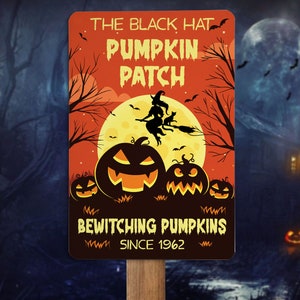 May include: A rectangular Halloween sign with the text "THE BLACK HAT PUMPKIN PATCH" above a graphic of a witch flying on a broom in front of a full moon. Below the graphic are three carved pumpkins and the text "BEWITCHING PUMPKINS SINCE 1962".