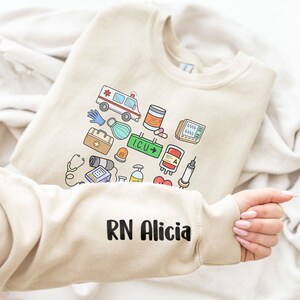 Custom Name Nurse Sweatshirt Nurse Hoodie Printed Sleeve School Nurse Shirt Nurse Life Shirt Registered Nurse Gift ICU Nurse Graduation Gift