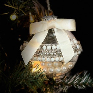 Pearlized Ornament with Rhinestone embellishments and a Cream Satin Bow