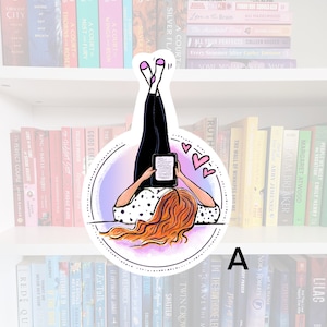 May include: A watercolour illustration of a woman reading an e-reader while lying on her back. The illustration is surrounded by a circle with a pink, purple and blue gradient. Two pink hearts are floating above the woman's head.