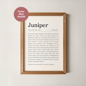May include: A framed print with the name "Juniper" in a serif font. The text describes the meaning and origin of the name, including its association with the juniper tree and its symbolism of protection and healing. A pink circle with the text "Custom Name Available" is in the upper left corner.