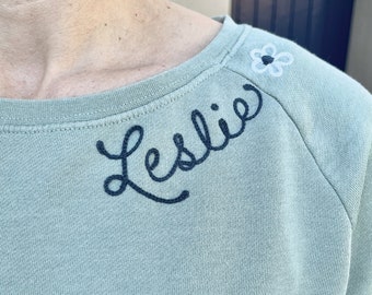 Chainstitched Custom Embroidered Womens Crewneck Wide Neck Sweatshirt with Name on Collar in Cursive Script | Personalized Ladies Sweatshirt