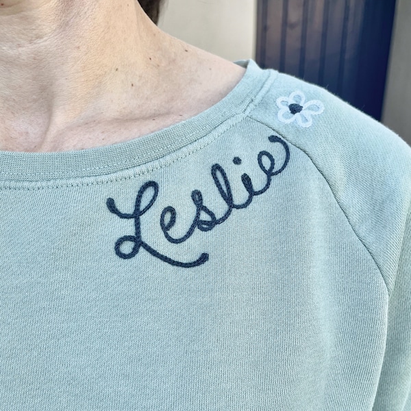 Chainstitched Custom Embroidered Womens Crewneck Wide Neck Sweatshirt with Name on Collar in Cursive Script | Personalized Ladies Sweatshirt