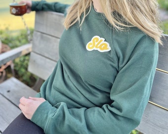 SLO San Luis Obispo Crewneck Dark Forest Green Sweatshirt with Chainstitched Patch in Gold | Central Coast CA College Style Raglan Crew
