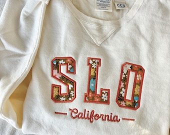 SLO San Luis Obispo Crewneck Ivory Off-White Sweatshirt with Floral Applique Design | Central Coast California College Style Crew