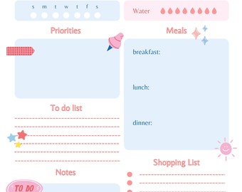 May include: A light blue and pink daily planner with a cherry design. The planner has sections for priorities, to do list, notes, meals, water, and a shopping list. The planner has a cute and whimsical design.