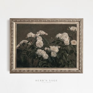 May include: A vintage framed painting of white roses in a dark green vase. The painting is in a gold frame with a decorative border.