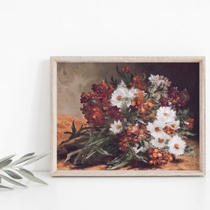 This vintage floral artwork features earthy reds, warm oranges and white colors. This vintage art piece would go perfect on any warm earthy colored walls!