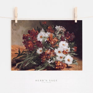 This vintage floral artwork features earthy reds, warm oranges and white colors. This vintage art piece would go perfect on any warm earthy colored walls!