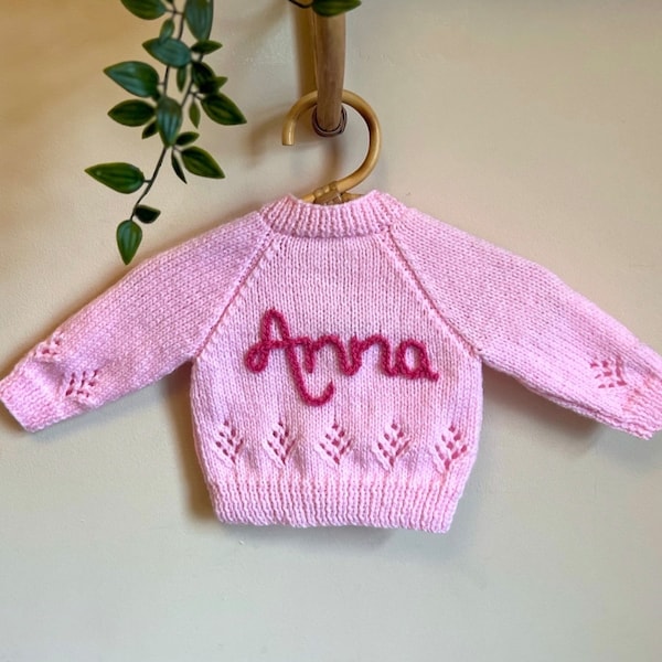0-3 months personalised hand knitted baby cardigans. Hand embroidered cardigans. Baby name knits.