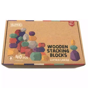 May include: A box of 40 extra large wooden stacking blocks in various colours. The box is brown with the text "Wooden Stacking Blocks Extra Large" and "BunMo" printed on it. The box also has a picture of a tower of blocks.